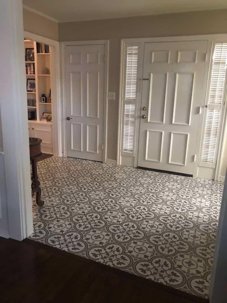 Patterned gray and white tile floor in entryway