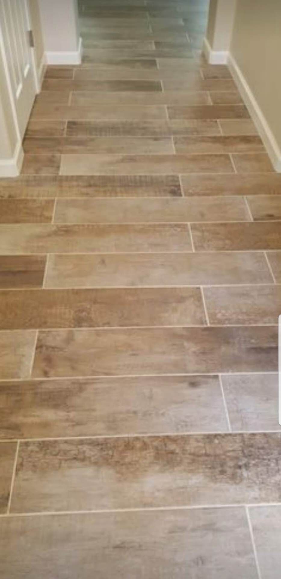 Wood-look plank tile flooring in a hallway